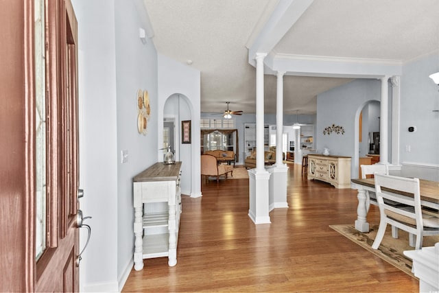 29 Saltwind Loop, Murrells Inlet, SC 29576 - entrance foyer featuring a ceiling fan, light wood-type flooring, arched walkways, crown molding, and baseboards