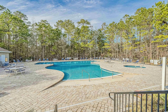 29 Saltwind Loop, Murrells Inlet, SC 29576 - community pool featuring a patio area and view of scattered trees