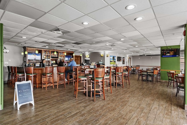 2801 S Ocean Blvd Unit 835, North Myrtle Beach, SC 29582 - dining area featuring wood finished floors and a bar