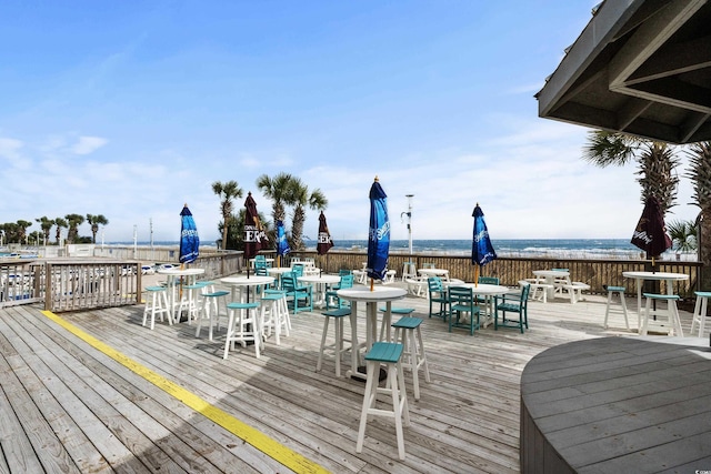 2801 S Ocean Blvd Unit 835, North Myrtle Beach, SC 29582 - wooden deck featuring outdoor dining space and a water view