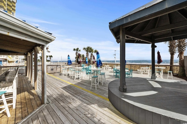 2801 S Ocean Blvd Unit 835, North Myrtle Beach, SC 29582 - wooden terrace featuring outdoor dining area and a water view