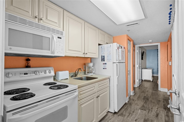 2801 S Ocean Blvd Unit 835, North Myrtle Beach, SC 29582 - kitchen with white appliances, wood finished floors, and light countertops