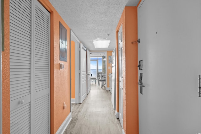 2801 S Ocean Blvd Unit 835, North Myrtle Beach, SC 29582 - hall with a textured ceiling and light wood finished floors