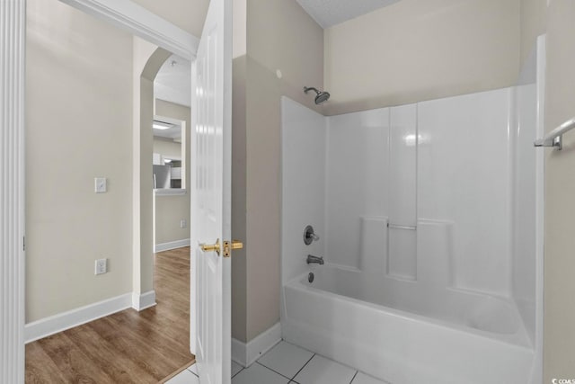 2241 Waterview Dr Unit 514, North Myrtle Beach, SC 29582 - bathroom featuring bathtub / shower combination, baseboards, and wood finished floors
