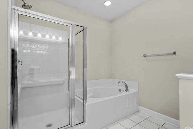 2241 Waterview Dr Unit 514, North Myrtle Beach, SC 29582 - bathroom featuring a shower stall, a garden tub, tile patterned flooring, and baseboards