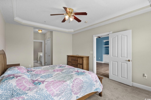 2241 Waterview Dr Unit 514, North Myrtle Beach, SC 29582 - bedroom with a tray ceiling, crown molding, light carpet, baseboards, and ceiling fan