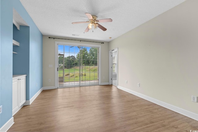 2241 Waterview Dr Unit 514, North Myrtle Beach, SC 29582 - empty room featuring ceiling fan, wood finished floors, a textured ceiling, and baseboards