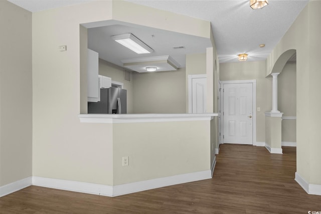 2241 Waterview Dr Unit 514, North Myrtle Beach, SC 29582 - kitchen featuring stainless steel fridge, dark wood-style flooring, baseboards, and white cabinetry