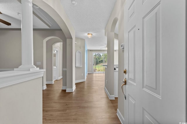 2241 Waterview Dr Unit 514, North Myrtle Beach, SC 29582 - entryway with a ceiling fan, wood finished floors, baseboards, a textured ceiling, and arched walkways