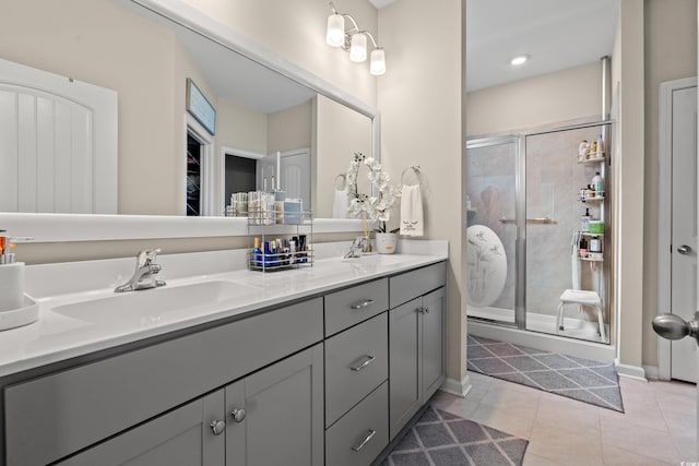 915 Sorano St, Myrtle Beach, SC 29579 - bathroom featuring double vanity, a shower stall, tile patterned floors, a closet, and baseboards
