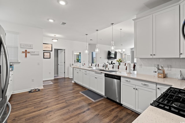 915 Sorano St, Myrtle Beach, SC 29579 - kitchen featuring stainless steel appliances, a peninsula, a sink, a chandelier, and backsplash