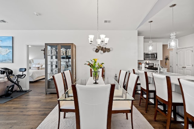 915 Sorano St, Myrtle Beach, SC 29579 - dining room featuring a chandelier and dark wood finished floors