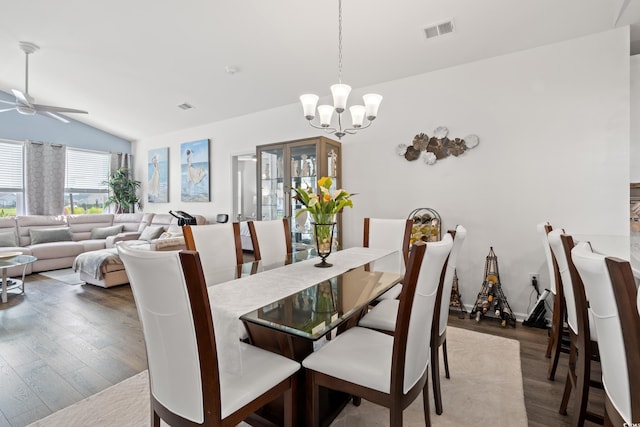 915 Sorano St, Myrtle Beach, SC 29579 - dining area with vaulted ceiling, ceiling fan, a chandelier, and dark wood-style floors