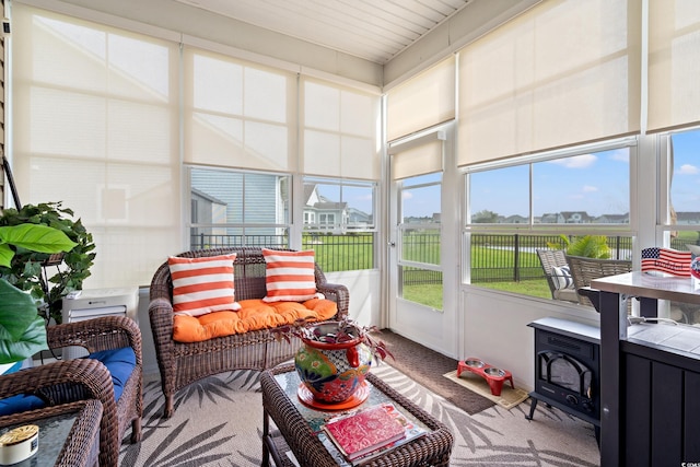 915 Sorano St, Myrtle Beach, SC 29579 - sunroom / solarium featuring carpet and a wood stove