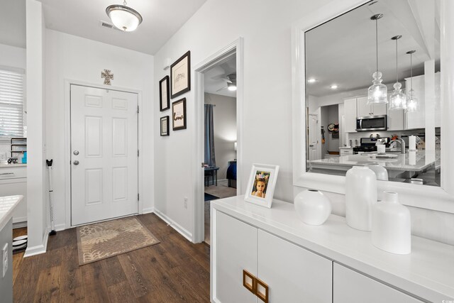 915 Sorano St, Myrtle Beach, SC 29579 - foyer with dark wood-style flooring and baseboards