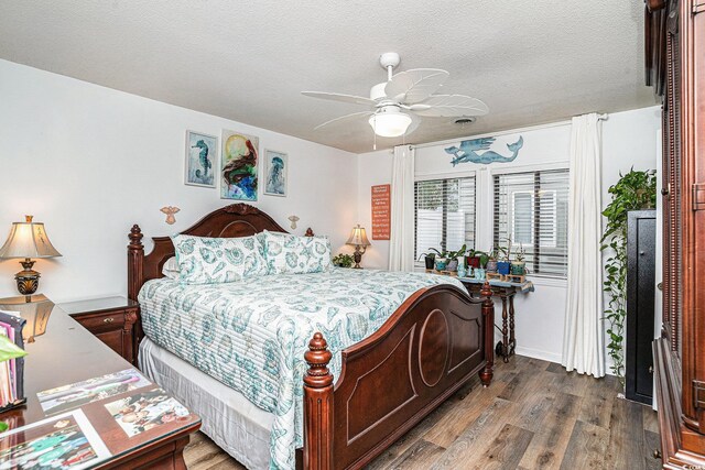 705 11th Ave S, North Myrtle Beach, SC 29582 - bedroom with wood finished floors, a textured ceiling, and a ceiling fan