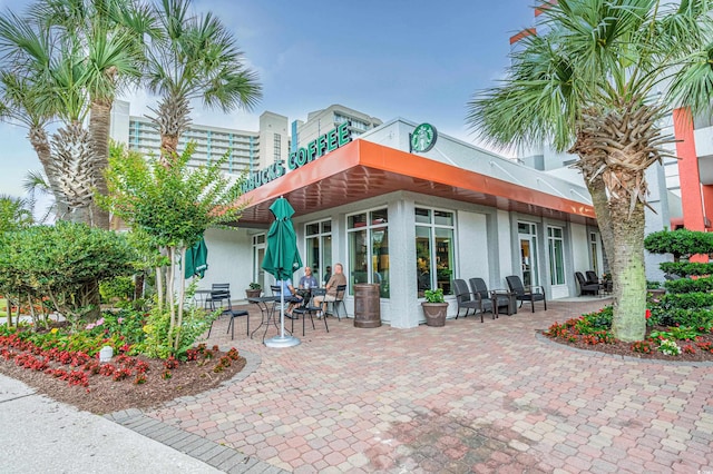 7200 N Ocean Blvd Unit 260, Myrtle Beach, SC 29572 - rear view of property with stucco siding and a patio area