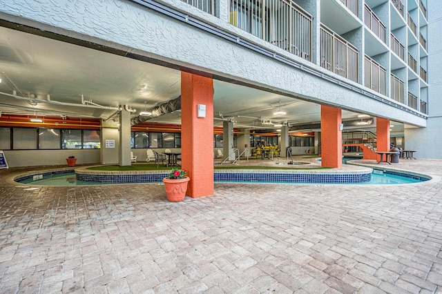 7200 N Ocean Blvd Unit 260, Myrtle Beach, SC 29572 - indoor pool with a patio, stairway, and outdoor dining area
