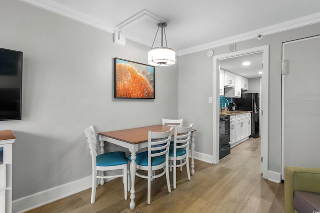 7200 N Ocean Blvd Unit 260, Myrtle Beach, SC 29572 - dining space featuring light wood-style flooring and crown molding