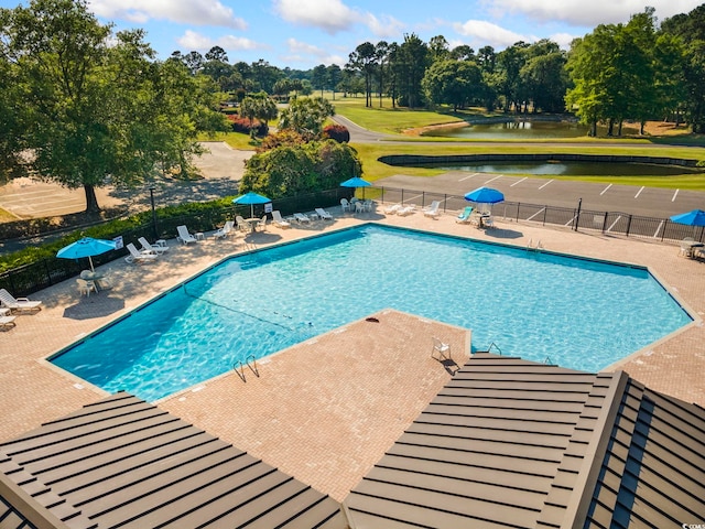 168 Mackinley Cir, Pawleys Island, SC 29585 - community pool featuring a patio area and view of scattered trees