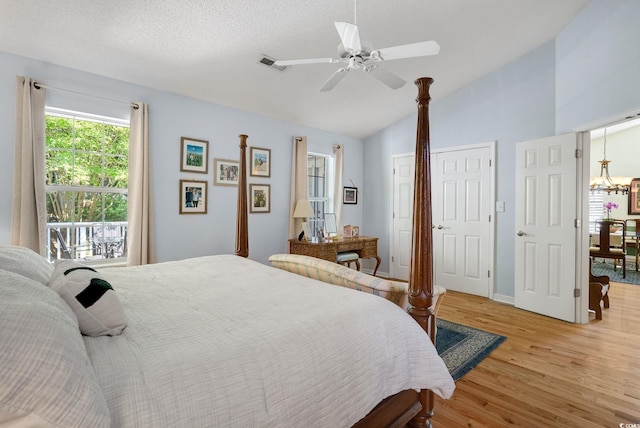 168 Mackinley Cir, Pawleys Island, SC 29585 - bedroom with light wood-type flooring, lofted ceiling, a ceiling fan, and a chandelier