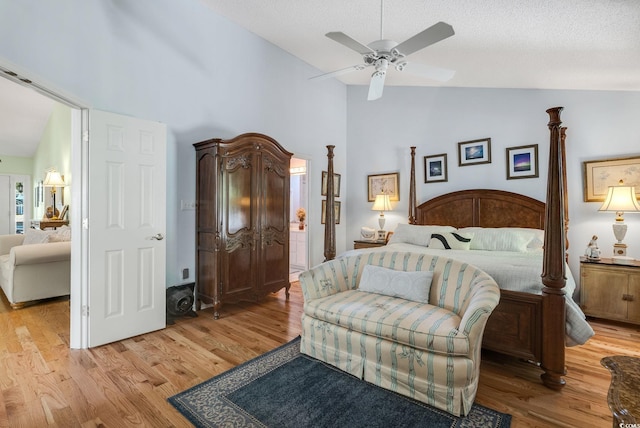 168 Mackinley Cir, Pawleys Island, SC 29585 - bedroom featuring high vaulted ceiling, light wood-type flooring, ceiling fan, and a textured ceiling