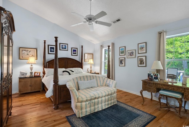 168 Mackinley Cir, Pawleys Island, SC 29585 - bedroom featuring lofted ceiling, light wood-style floors, a textured ceiling, an office area, and a ceiling fan