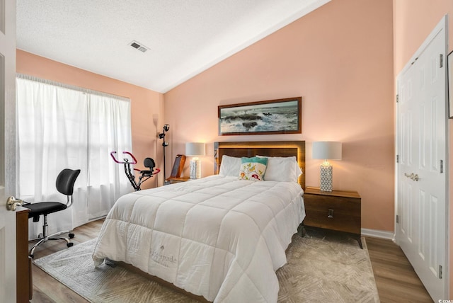 168 Mackinley Cir, Pawleys Island, SC 29585 - bedroom featuring vaulted ceiling and wood finished floors