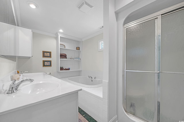 3231 Center Rd, Georgetown, SC 29440 - bathroom with a bath, a shower with door, double vanity, recessed lighting, and crown molding