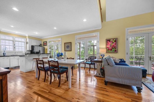 3231 Center Rd, Georgetown, SC 29440 - dining room featuring french doors, ornamental molding, light wood-style floors, and recessed lighting
