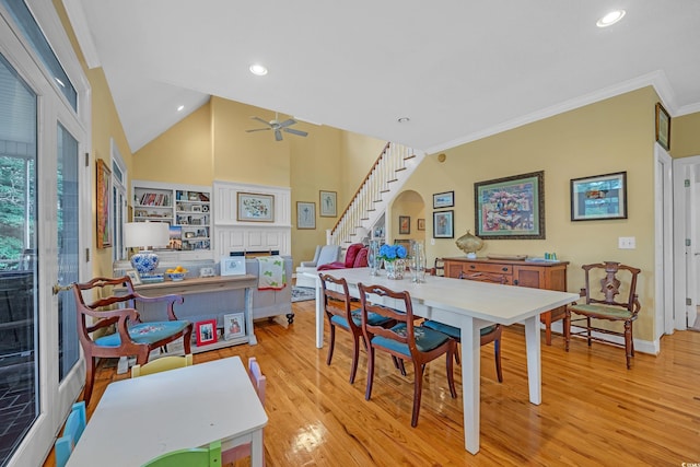 3231 Center Rd, Georgetown, SC 29440 - dining room with a fireplace, wood finished floors, stairway, ceiling fan, and crown molding