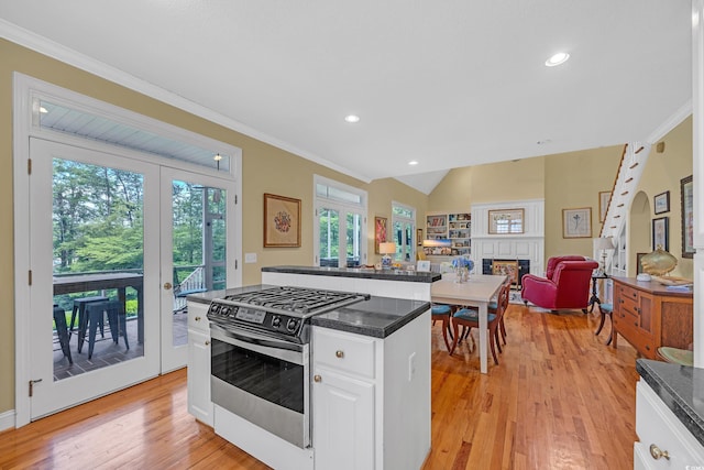 3231 Center Rd, Georgetown, SC 29440 - kitchen with stainless steel range with gas stovetop, french doors, ornamental molding, healthy amount of natural light, and dark countertops