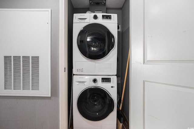 300 N Ocean Blvd Unit 723, North Myrtle Beach, SC 29582 - laundry room featuring stacked washer and clothes dryer