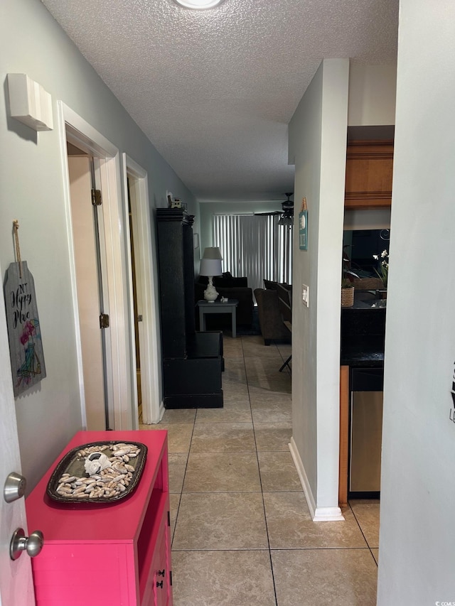 201 Hillside Dr N Unit 111, North Myrtle Beach, SC 29582 - hallway featuring tile patterned flooring and a textured ceiling