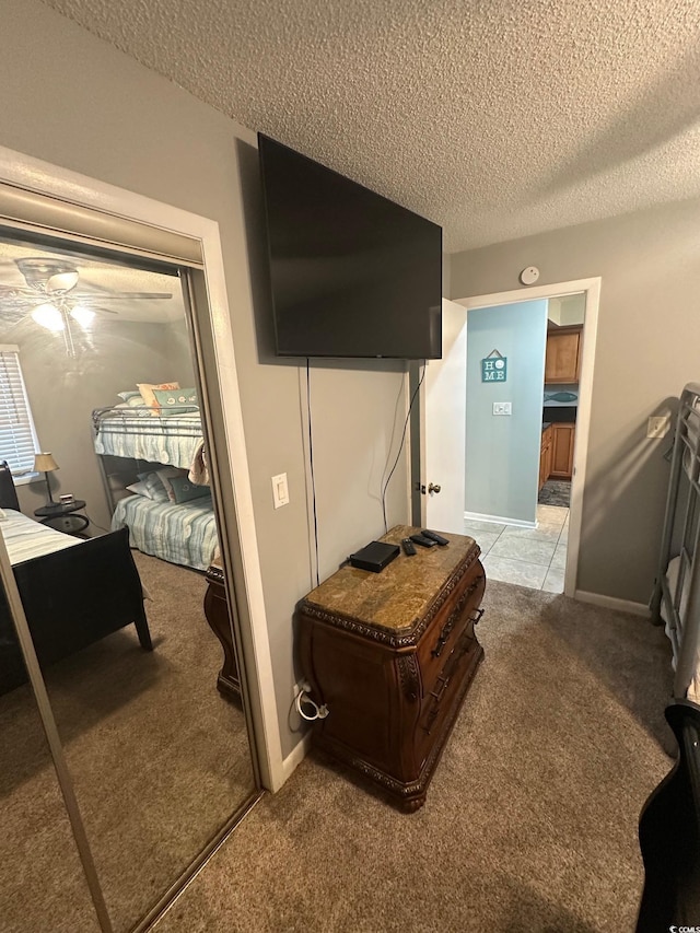 201 Hillside Dr N Unit 111, North Myrtle Beach, SC 29582 - carpeted bedroom with a textured ceiling and baseboards