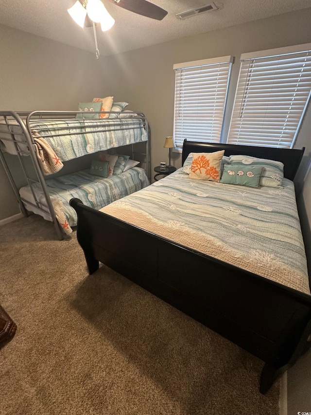 201 Hillside Dr N Unit 111, North Myrtle Beach, SC 29582 - carpeted bedroom with a ceiling fan and a textured ceiling