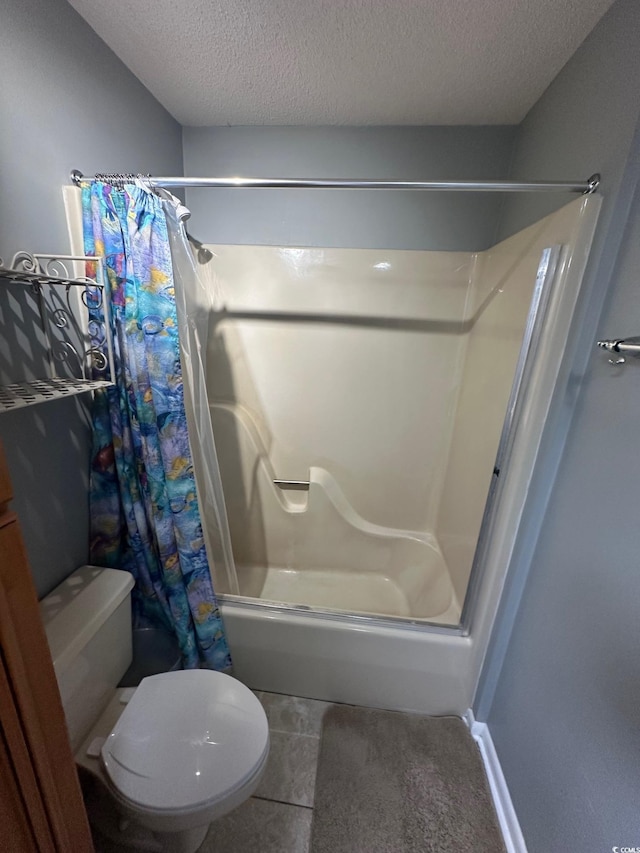 201 Hillside Dr N Unit 111, North Myrtle Beach, SC 29582 - full bathroom featuring toilet, shower / tub combo with curtain, a textured ceiling, and tile patterned floors