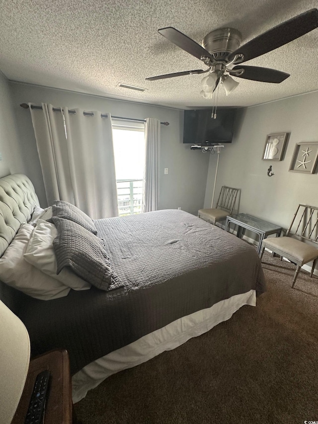 201 Hillside Dr N Unit 111, North Myrtle Beach, SC 29582 - bedroom with ceiling fan, a textured ceiling, and carpet flooring