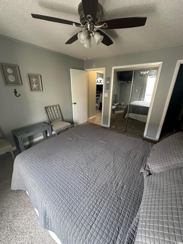 201 Hillside Dr N Unit 111, North Myrtle Beach, SC 29582 - bedroom with a textured ceiling, a ceiling fan, a closet, and carpet