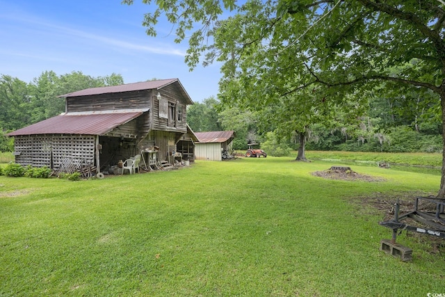 1731 Lee Ln, Longs, SC 29568 - view of grassy yard featuring an outdoor structure and a barn