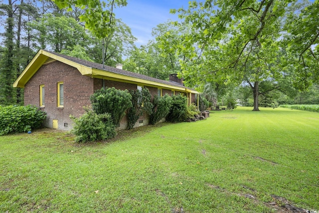 1731 Lee Ln, Longs, SC 29568 - view of side of property with brick siding, a chimney, a yard, and crawl space
