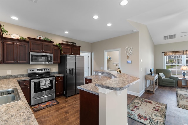 177 Baylee Cir, Galivants Ferry, SC 29544 - kitchen with appliances with stainless steel finishes, dark wood-type flooring, light countertops, recessed lighting, and lofted ceiling