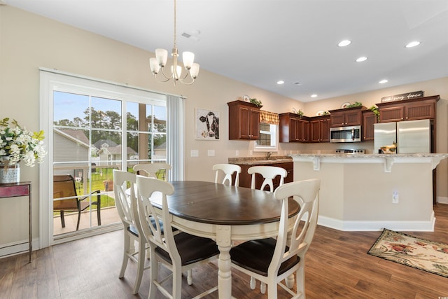 177 Baylee Cir, Galivants Ferry, SC 29544 - dining area with wood finished floors, a chandelier, and recessed lighting