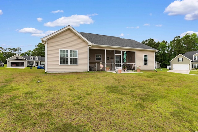 177 Baylee Cir, Galivants Ferry, SC 29544 - back of property with a lawn, a detached garage, and a sunroom