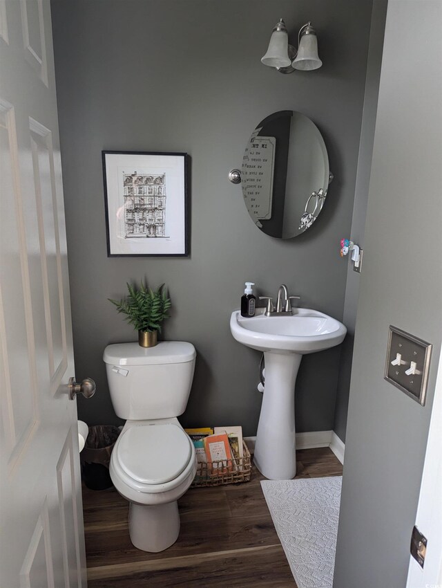 2834 Howard Ave Unit D, Myrtle Beach, SC 29577 - bathroom with toilet, wood finished floors, baseboards, and a sink