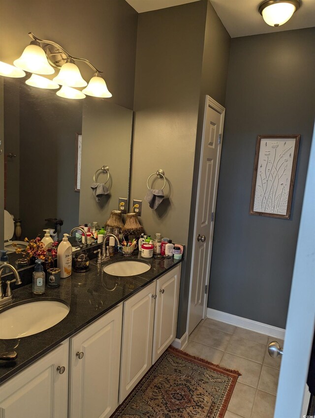 2834 Howard Ave Unit D, Myrtle Beach, SC 29577 - full bathroom featuring tile patterned floors, double vanity, and baseboards