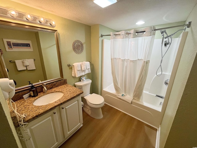 2007 S Ocean Blvd Unit 1506, Myrtle Beach, SC 29577 - bathroom with wood finished floors, vanity, toilet, shower / bath combination with curtain, and a textured ceiling