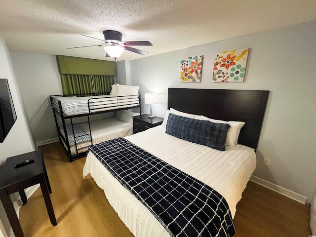 2007 S Ocean Blvd Unit 1506, Myrtle Beach, SC 29577 - bedroom featuring wood finished floors, baseboards, a textured ceiling, and a ceiling fan