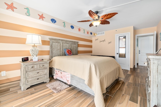 9820 Queensway Blvd Unit 502, Myrtle Beach, SC 29572 - bedroom with wood finished floors and a ceiling fan