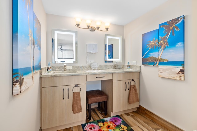 9820 Queensway Blvd Unit 502, Myrtle Beach, SC 29572 - bathroom with wood finished floors, double vanity, and baseboards